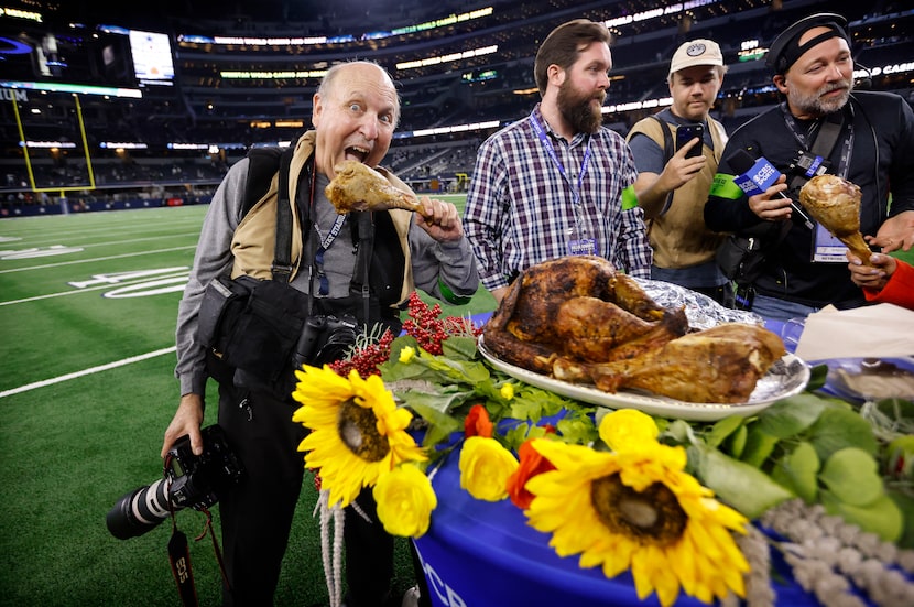 Former Dallas Morning News photographer John F. Rhodes ‘feasts’ on a turkey leg after the...
