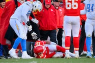 Los Angeles Chargers defensive tackle Justin Eboigbe (92) checks on Kansas City Chiefs...
