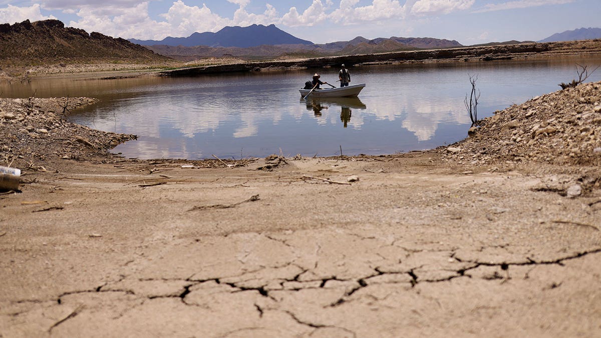 Boat in water surrounded by dry land.