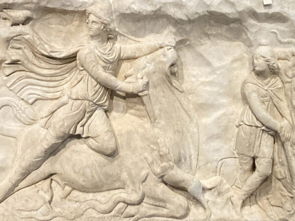 A close-up photograph of a marble relief sculpture.