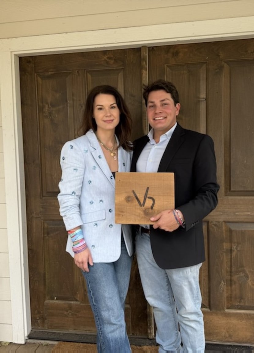 Lacey and Lars Hollis photographed at their Bellville home with a cattle brand designed by...