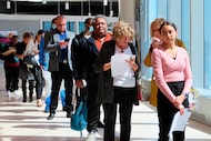 FILE - Applicants line up at a job fair at the Ocean Casino Resort in Atlantic City N.J., on...