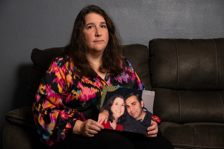 Brandi Rahimi with a photo of herself and her husband Shahrokh Rahimi, an Iranian immigrant who has lived in San Antonio for more than 20 years before he was detained by ICE.