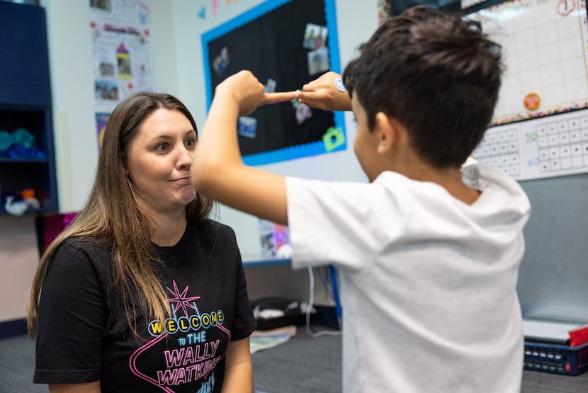 Jessica DiMaggio, an education for students with disabilities paraprofessional, watches a...