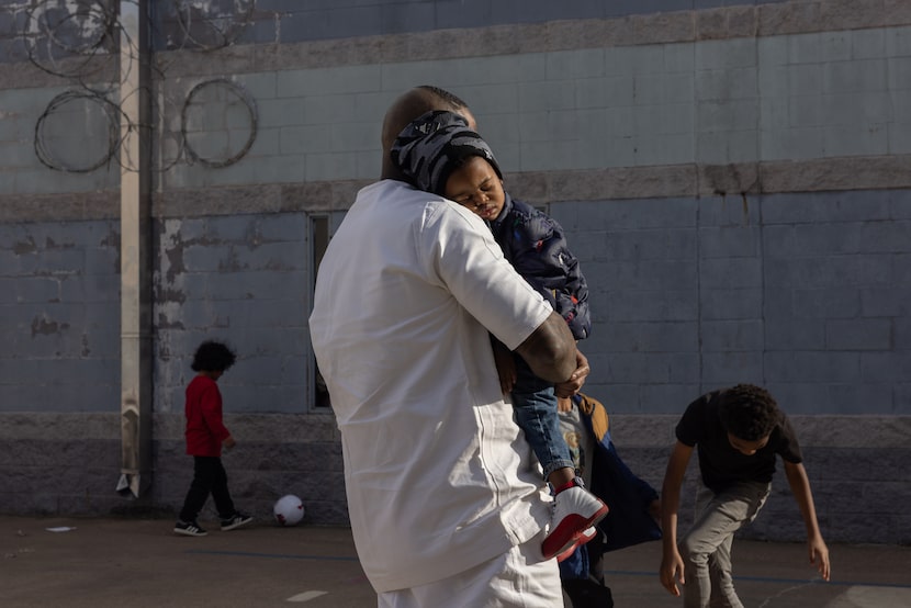 Lamar Simpson, an inmate at the Sanders Estes Unit prison in Venus, holds his sleeping...