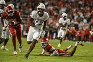 Texas A&M running back EJ Smith (22) runs for a big gain against Arkansas during an NCAA...