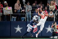 Kansas City Chiefs tight end Travis Kelce (87) catches a touchdown pass over Dallas Cowboys...