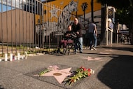 Flowers cover the Walk of Fame star for Rob Reiner on Monday, Dec. 15, 2025, in the...