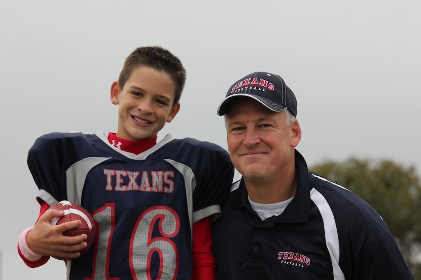 A young Ben Roberts poses for a photo alongside his father, John Roberts.