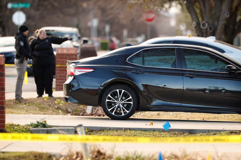 Grand Prairie Police Crime Scene investigators work at a home in the 1600 block of Ave B in...