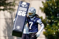 Dallas Cowboys cornerback Trevon Diggs (7) carries a pad during a practice at The Star,...