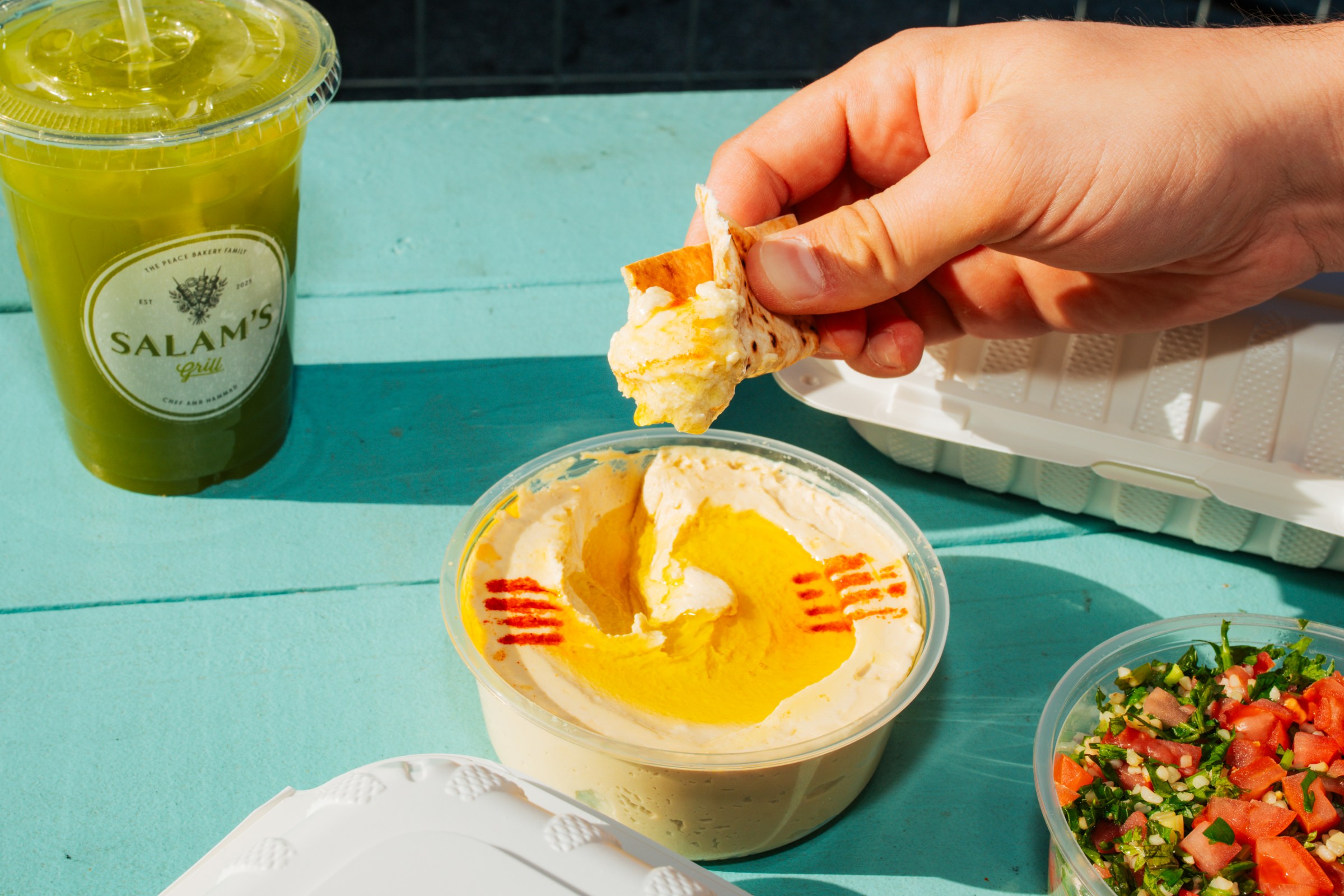 A container of hummus. 