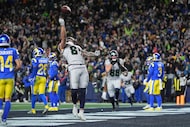 Seattle Seahawks tight end Eric Saubert (81) celebrates after making a two-point conversion...
