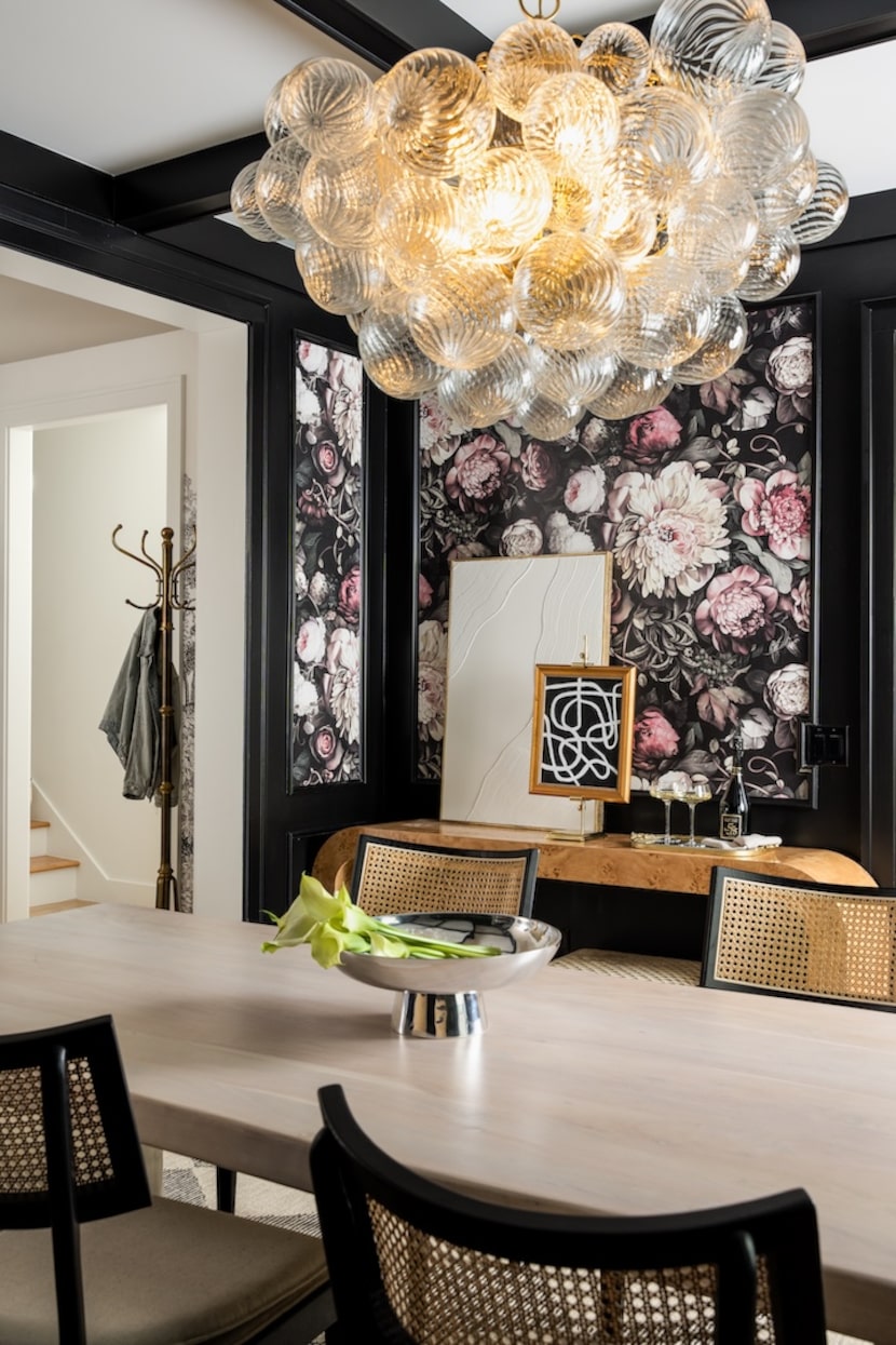 a bubble chandelier in a black-and-white dining room