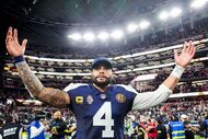 Dallas Cowboys quarterback Dak Prescott celebrates after a victory over the Kansas City...