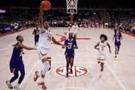 Texas forward Madison Booker (35) drives to the basket past Prairie View A&M center Preston...