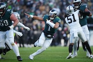 Philadelphia Eagles quarterback Jalen Hurts (1) runs with the ball during the second half of...
