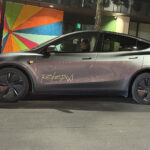 A Tesla Model Y Juniper Robotaxi ready to pickup riders during the launch day test rides.