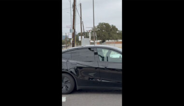 A black Tesla Robotaxi (Model Y Juniper) spotted without any human inside in Austin, Texas.
