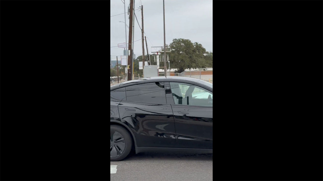 A black Tesla Robotaxi (Model Y Juniper) spotted without any human inside in Austin, Texas.