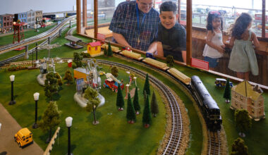 Children Viewing a Model Train Exhibit