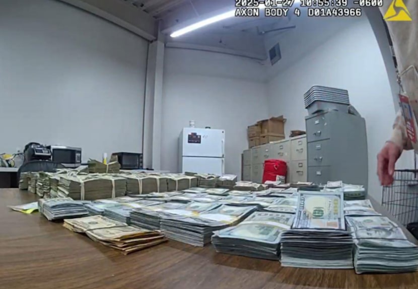 Federal agents display suspected drug money seized from a North Texas airline passenger.