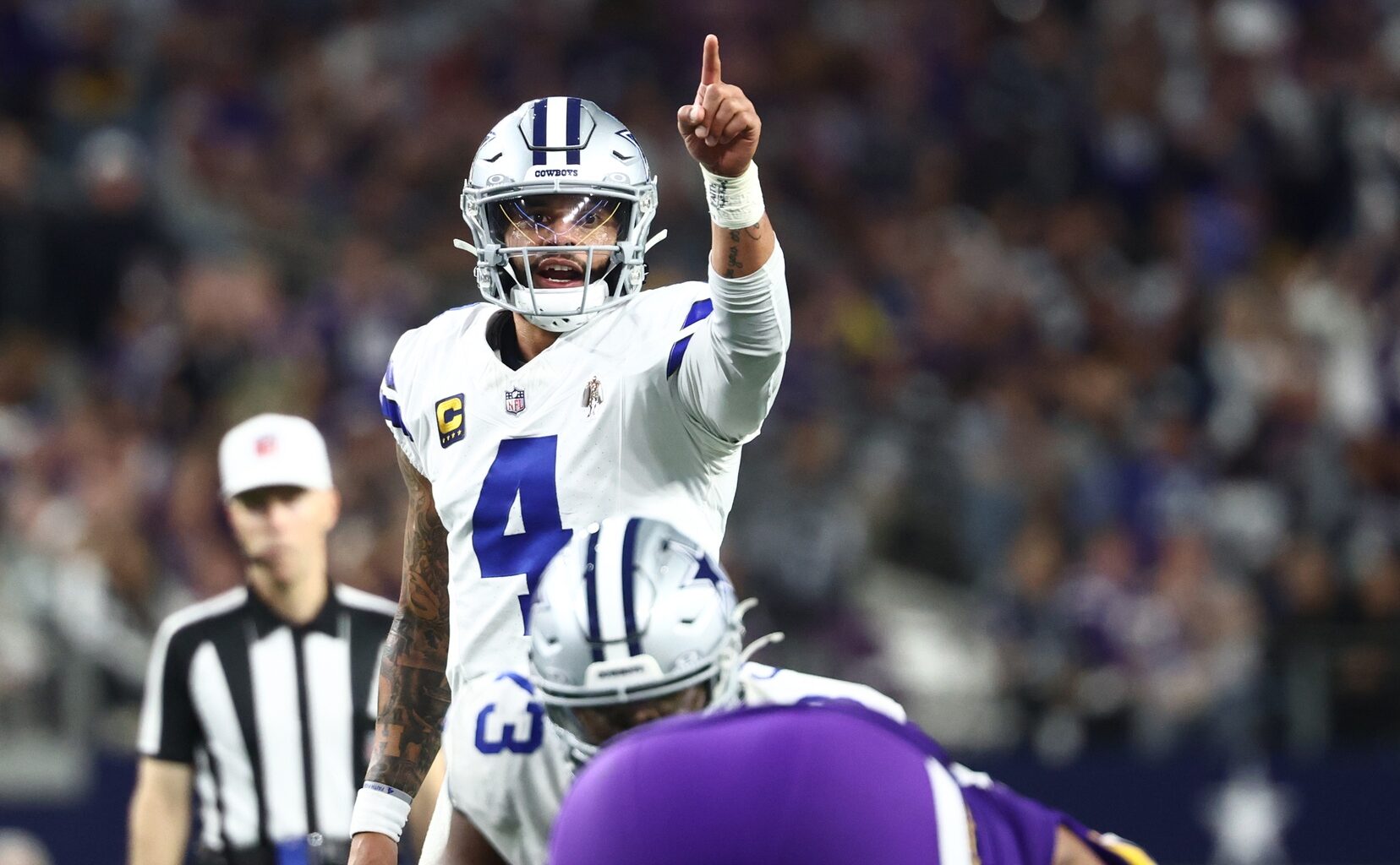 Dec 14, 2025; Arlington, Texas, USA; Dallas Cowboys quarterback Dak Prescott (4) calls signals during the second half against the Minnesota Vikings at AT&T Stadium.