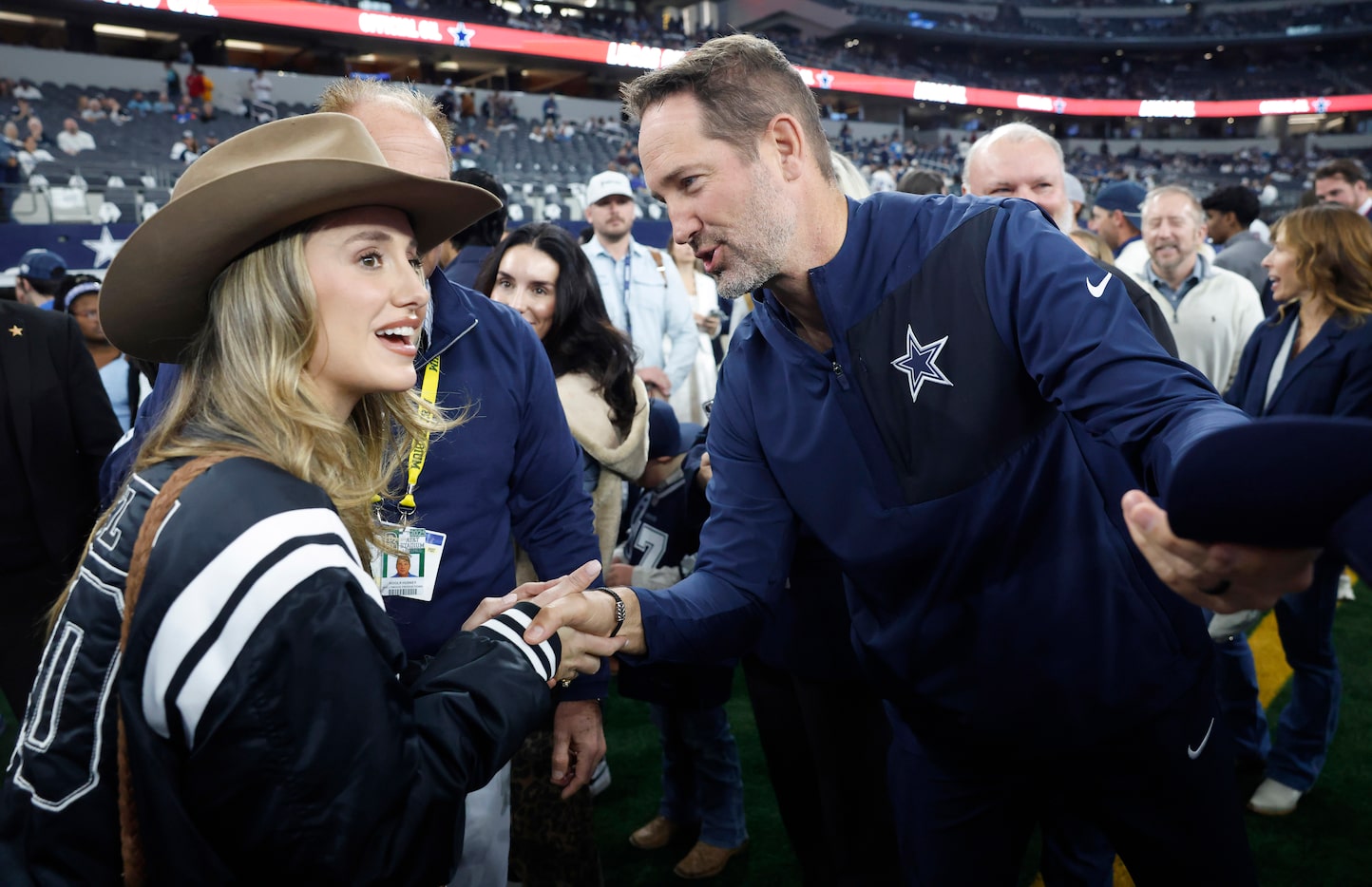 Dallas Cowboys head coach Brian Schottenheimer visits with country music artist Lainey...