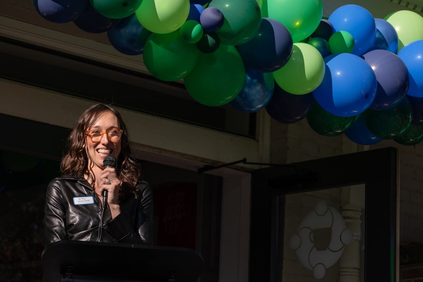 Hugs Cafe Executive Director Lauren Smith speaks at the grand opening of a new Hugs Cafe in...