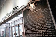 A historical marker is seen near the front entrance to the offices of The Dallas Morning...