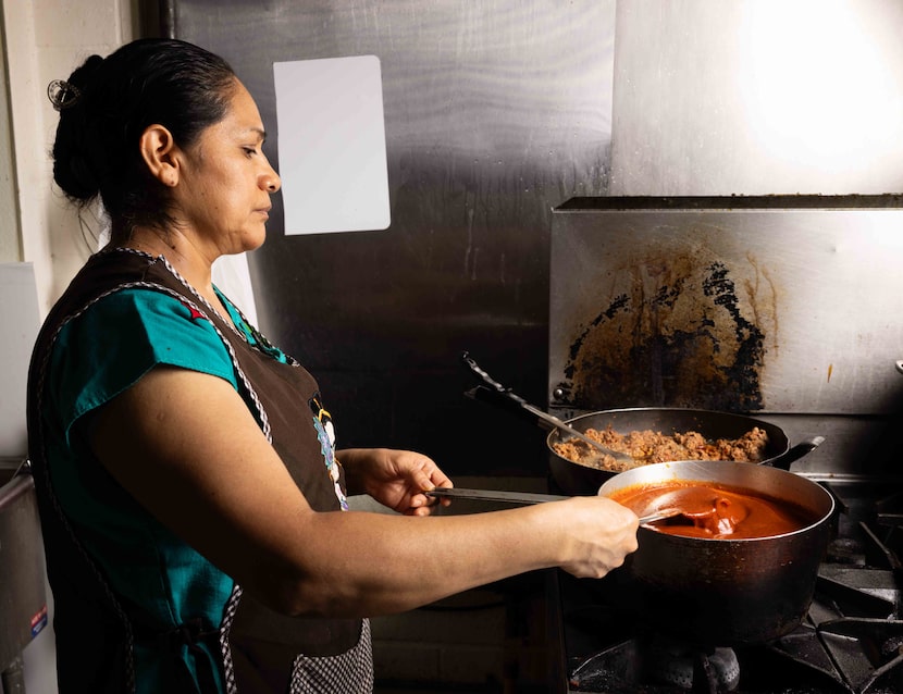 María Pastenes prepares pozole rojo at La Cocina del Bony Boy in Dallas on Thursday, Aug....
