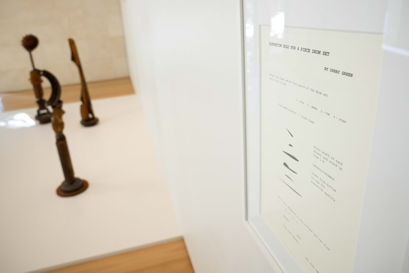 “Elevation Solo for 4 Piece Drum Set” by artist Oshay Green on display next to his...