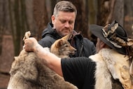 Matt James, executive director of the Colossal Foundation holds a cloned American Red Wolf...