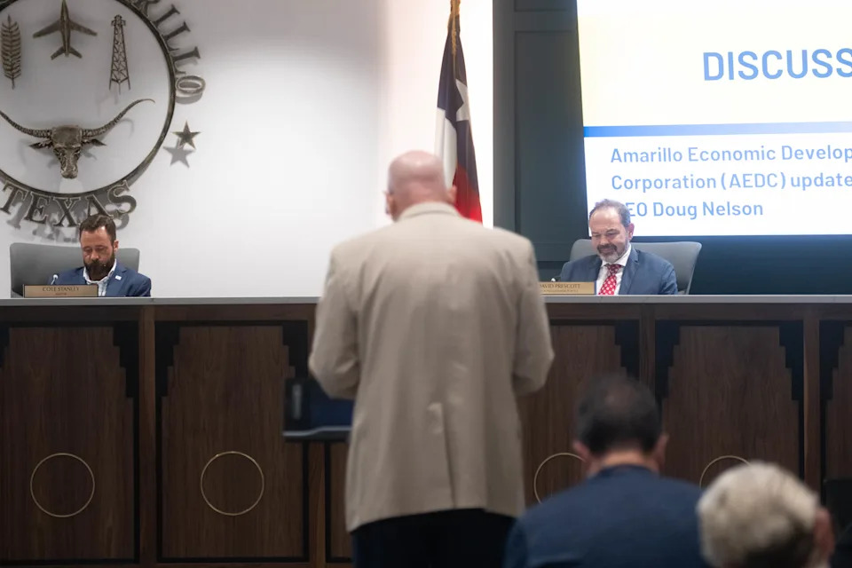 In this file photo, Amarillo Economic Development Corporation interim CEO Doug Nelson gives an update to the Amarillo City Council during a meeting in July, as Mayor Cole Stanley and Councilmember David Prescott look on.