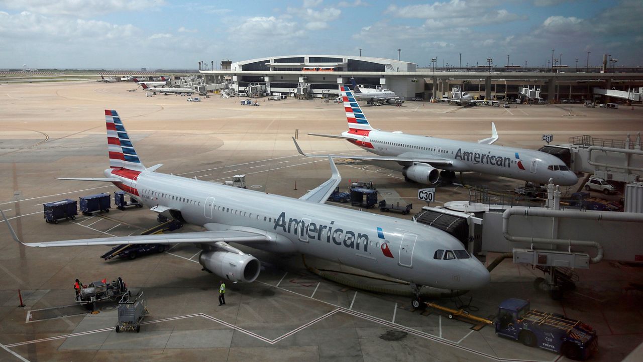 In this June 16, 2018, file photo, American Airlines aircrafts are seen at Dallas-Fort Worth International Airport in Grapevine, Texas. (AP Photo/Kiichiro Sato)