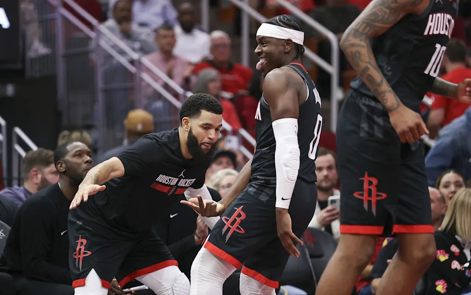 Nov 15, 2024; Houston, Texas, USA; Houston Rockets guard Aaron Holiday (0) reacts with guard Fred VanVleet (5) after making a basket during the fourth quarter against the Los Angeles Clippers at Toyota Center. Mandatory Credit: Troy Taormina-Imagn Images