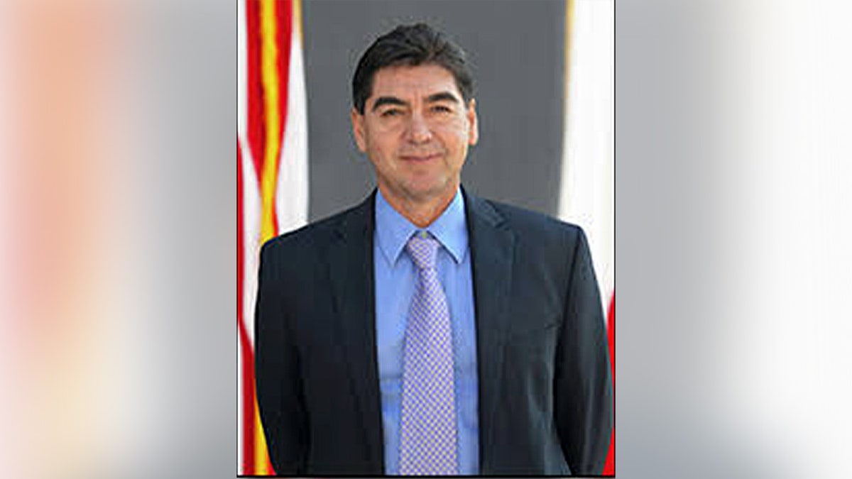 Eddy Betancourt wearing a suit and tie.