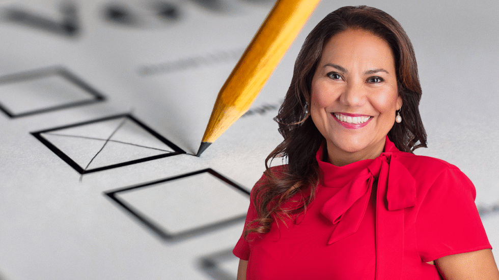 A picture of Veronica Escobar over a generic ballot with a pencil checking a choice.