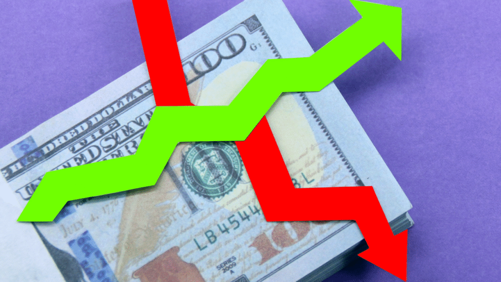 A illustration of money with a green arrow going up and a red arrow going down.