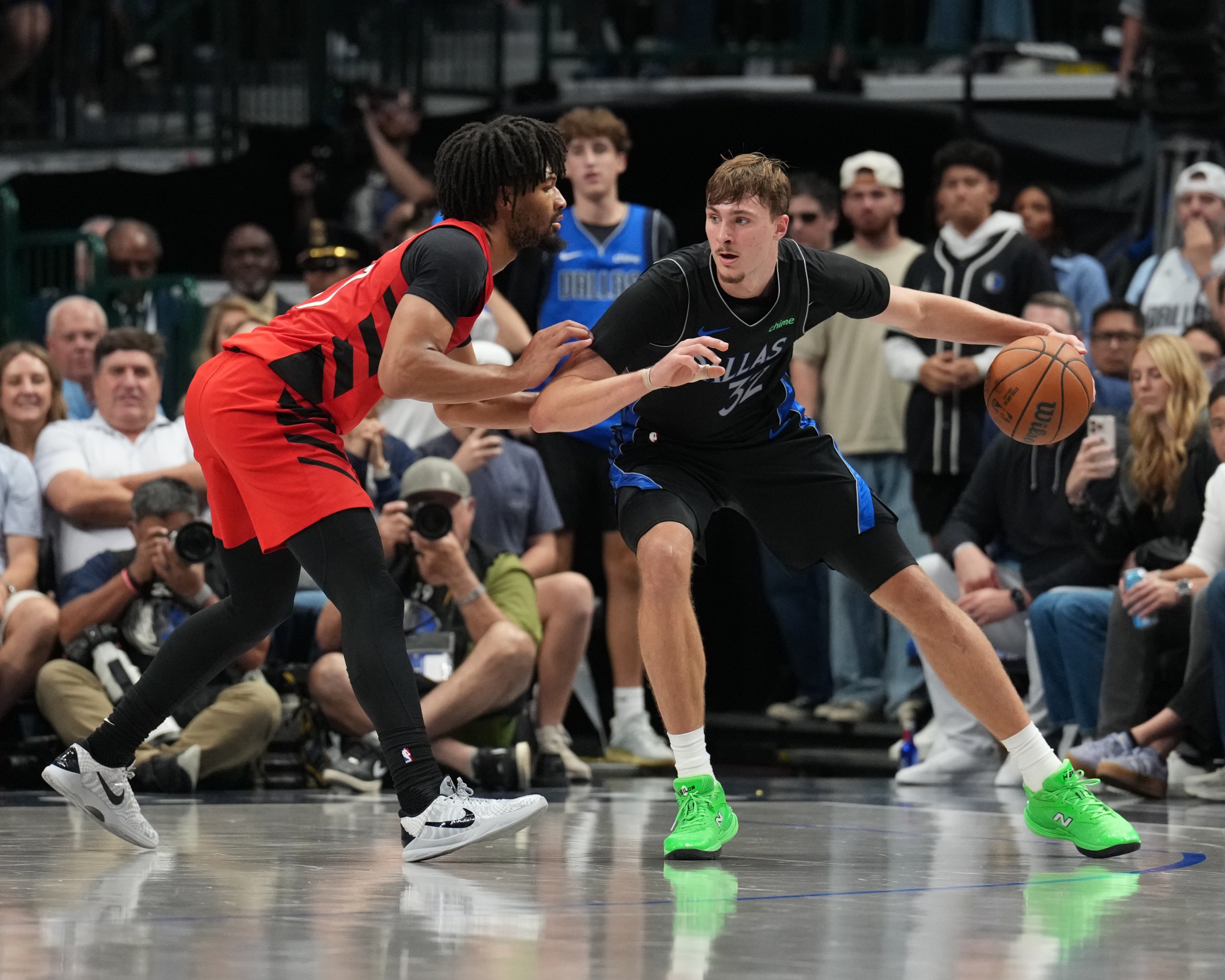 DALLAS, TX - NOVEMBER 16: Cooper Flagg #32 of the Dallas Mavericks handles the ball while defended by Shaedon Sharpe #17 of the Portland Trail Blazers during the game on November 16, 2025 at American Airlines Center in Dallas, Texas. NOTE TO USER: User expressly acknowledges and agrees that, by downloading and or using this photograph, User is consenting to the terms and conditions of the Getty Images License Agreement. Mandatory Copyright Notice: Copyright 2025 NBAE (Photo by Glenn James/NBAE via Getty Images)
