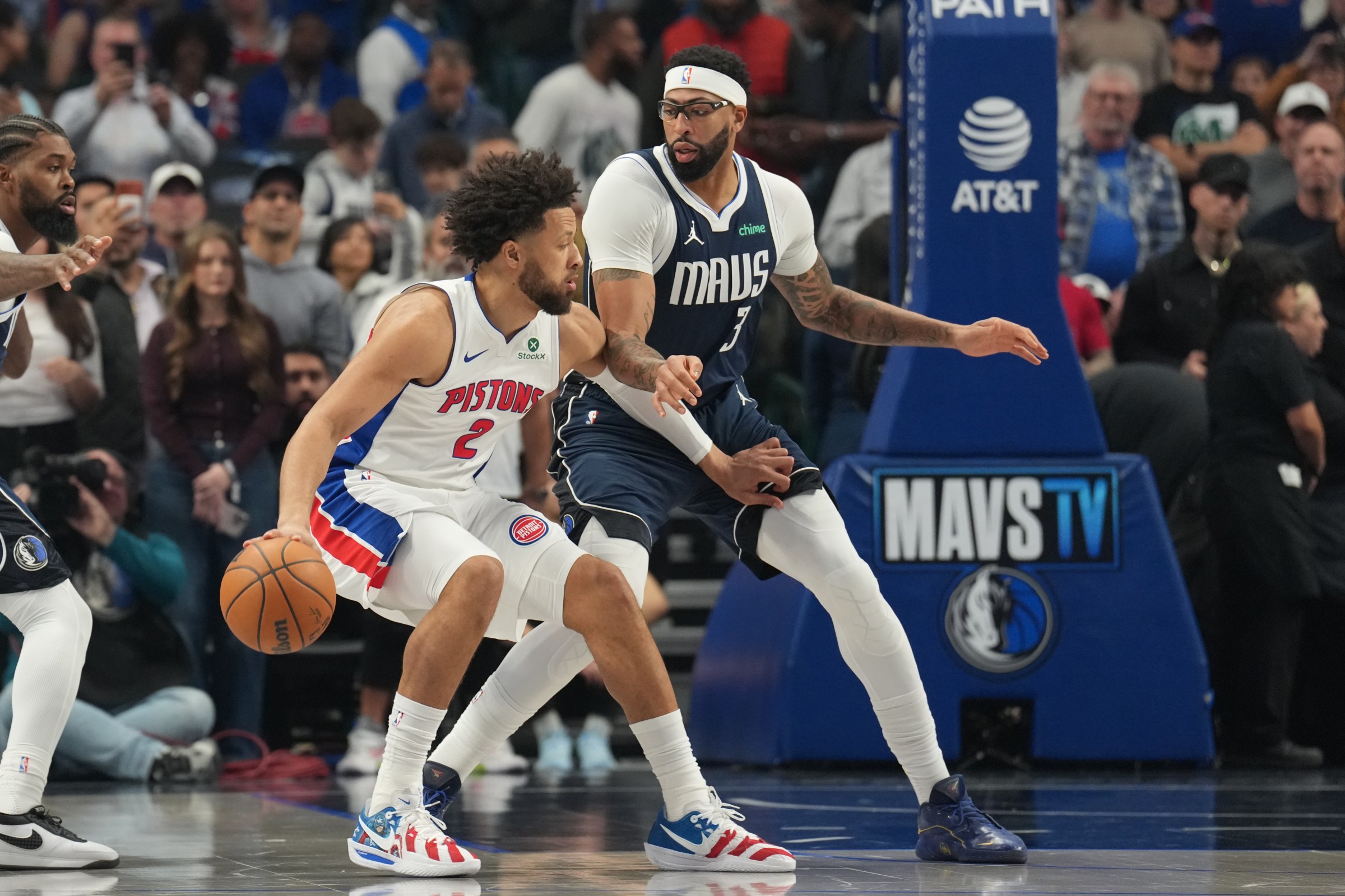 DALLAS, TX - DECEMBER 18: Cade Cunningham #2 of the Detroit Pistons dribbles the ball as Anthony Davis #3 of the Dallas Mavericks plays defense during the game on December 18, 2025 at American Airlines Center in Dallas, Texas. NOTE TO USER: User expressly acknowledges and agrees that, by downloading and or using this photograph, User is consenting to the terms and conditions of the Getty Images License Agreement. Mandatory Copyright Notice: Copyright 2025 NBAE (Photo by Glenn James/NBAE via Getty Images)