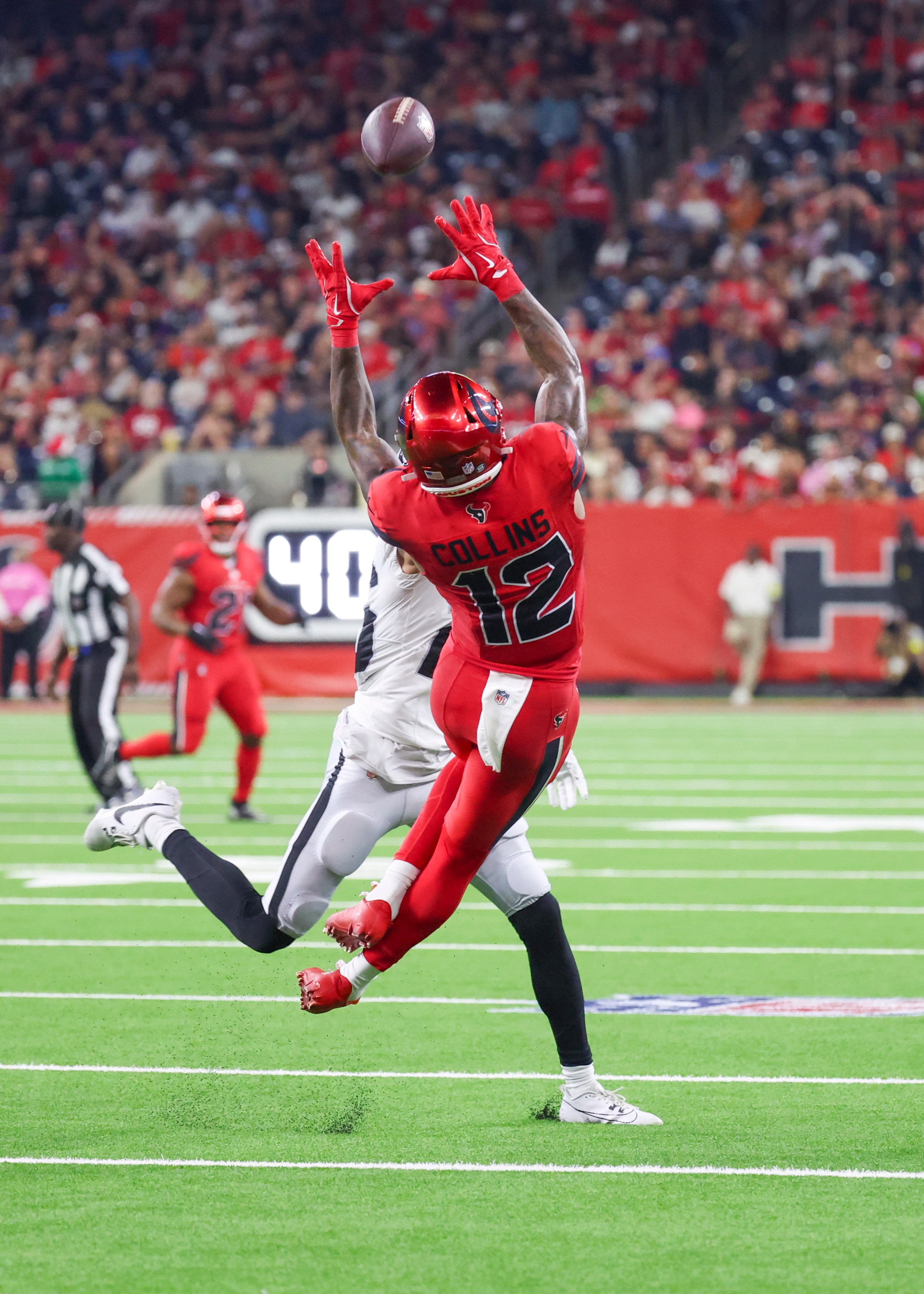 HOUSTON, TX - DECEMBER 21: Houston Texans wide receiver Nico Collins (12) jumps to complete a catch in the fourth quarter during the NFL game between the Las Vegas Raiders and Houston Texans on December 21, 2025 at NRG Stadium in Houston, Texas. (Photo by Leslie Plaza Johnson/Icon Sportswire via Getty Images)