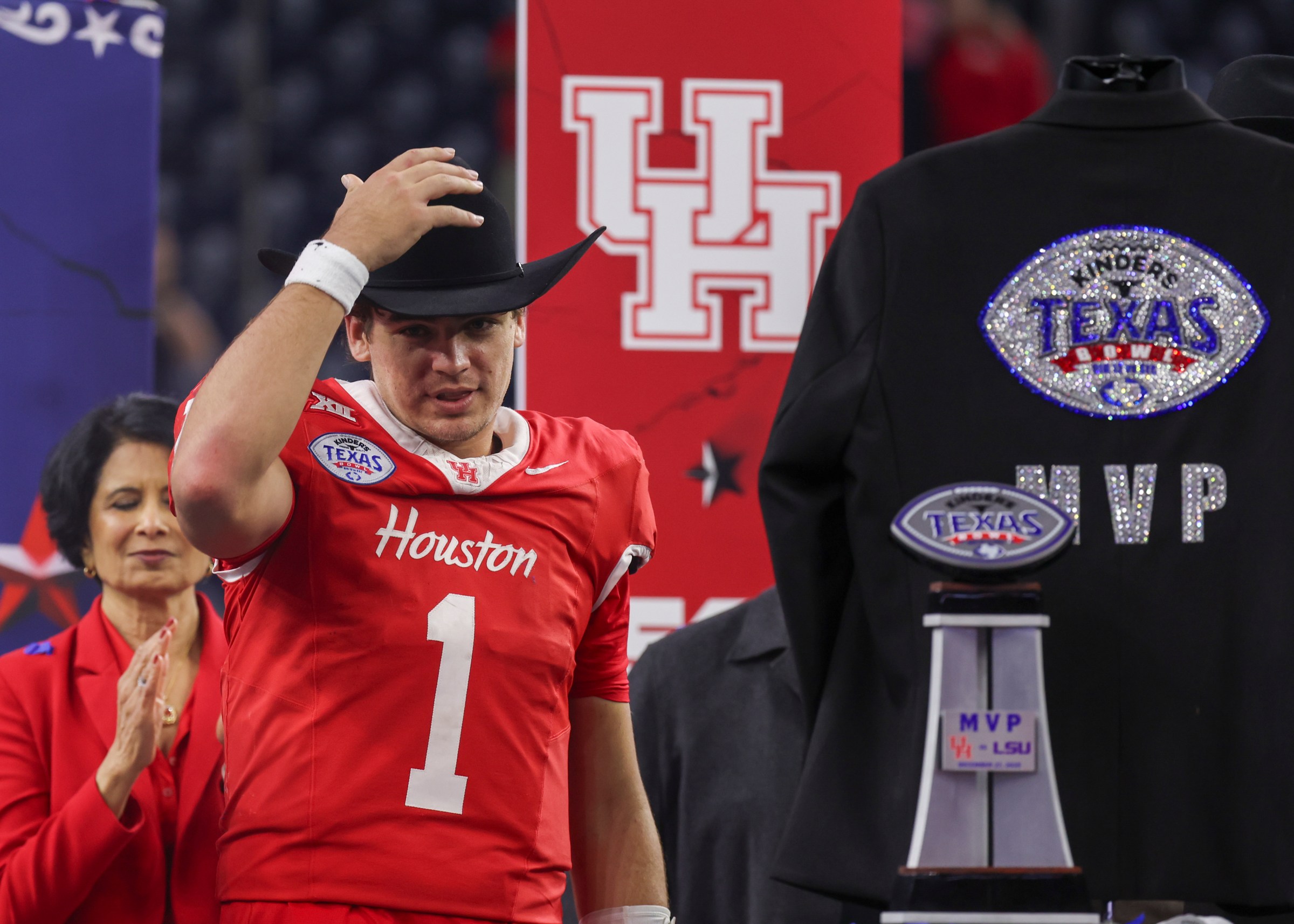 HOUSTON, TX - DECEMBER 27: Houston Cougars quarterback Conner Weigman (1) dons the MVP cowboy hat after the team’s 38-35 win during the Kinder’s Texas Bowl between the LSU Tigers and Houston Cougars on December 27,2025 at NRG Stadium in Houston, Texas. (Photo by Leslie Plaza Johnson/Icon Sportswire via Getty Images)