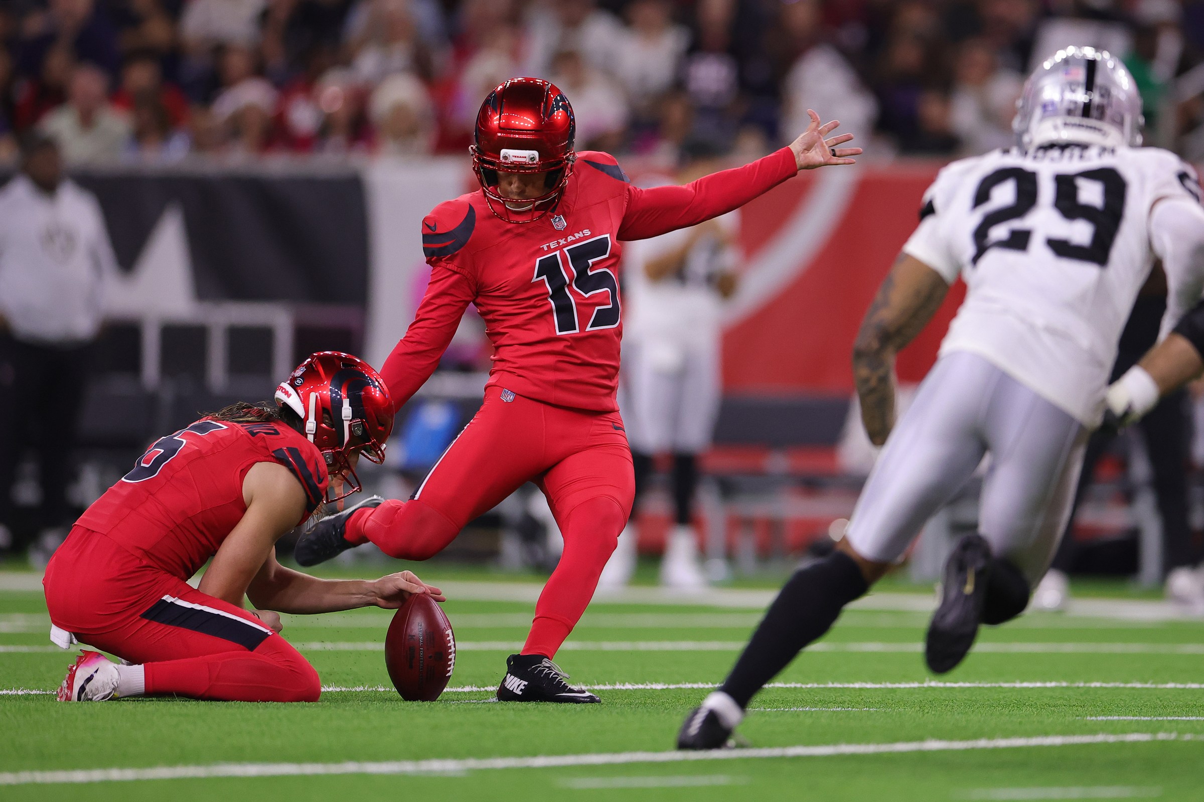 HOUSTON, TEXAS - DECEMBER 21: Ka’Imi Fairbairn #15 of the Houston Texans kicks a field goal during the third quarter against the Las Vegas Raiders at NRG Stadium on December 21, 2025 in Houston, Texas. (Photo by Alex Slitz/Getty Images)