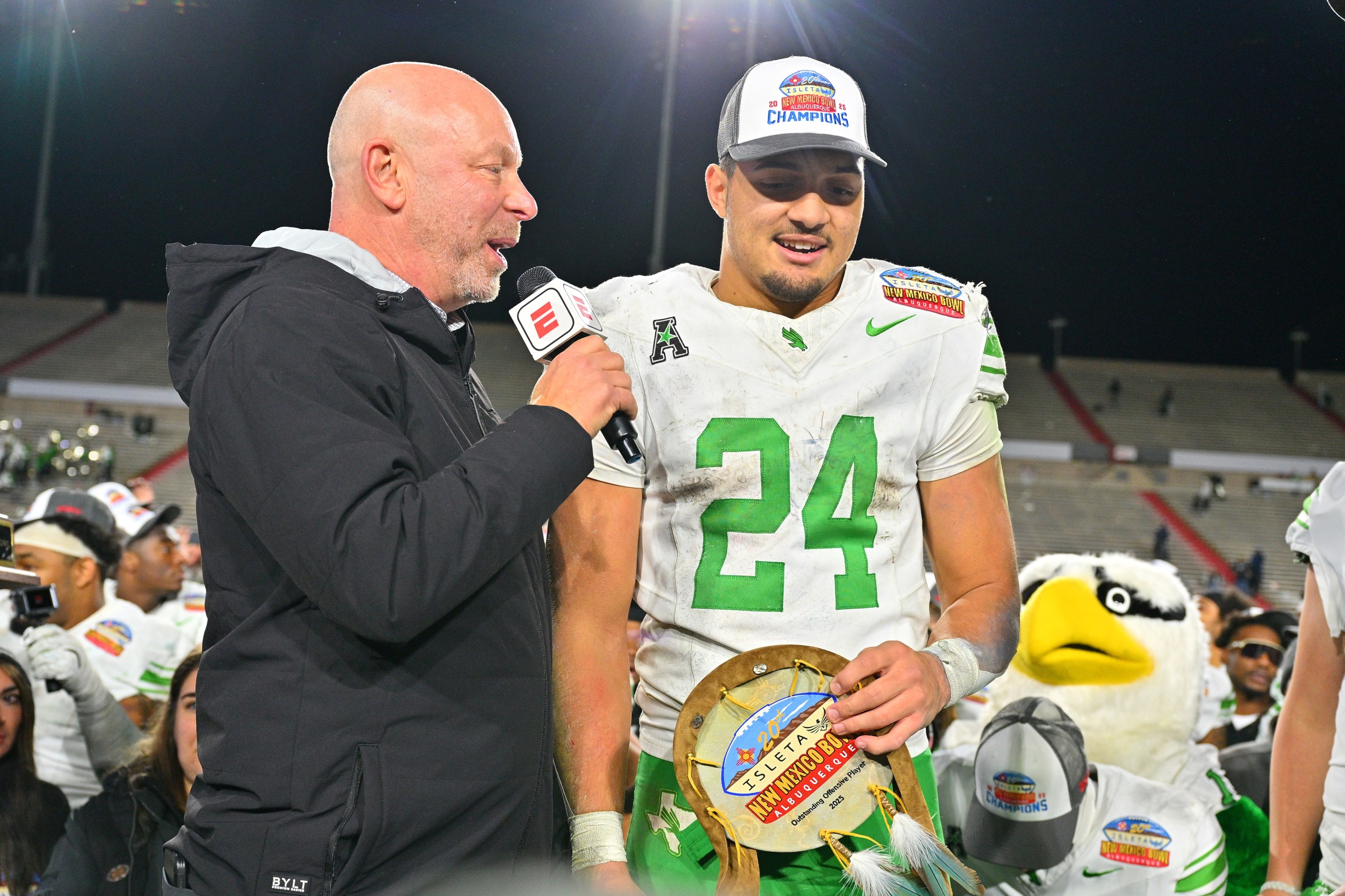 ALBUQUERQUE, NEW MEXICO - DECEMBER 27: Running back Caleb Hawkins #24 of the North Texas Mean Green receives the award for Outstanding Offensive Player after his team defeated the San Diego State Aztecs 49-47 in the Isleta New Mexico Bowl at University Stadium on December 27, 2025 in Albuquerque, New Mexico. (Photo by Sam Wasson/Getty Images)