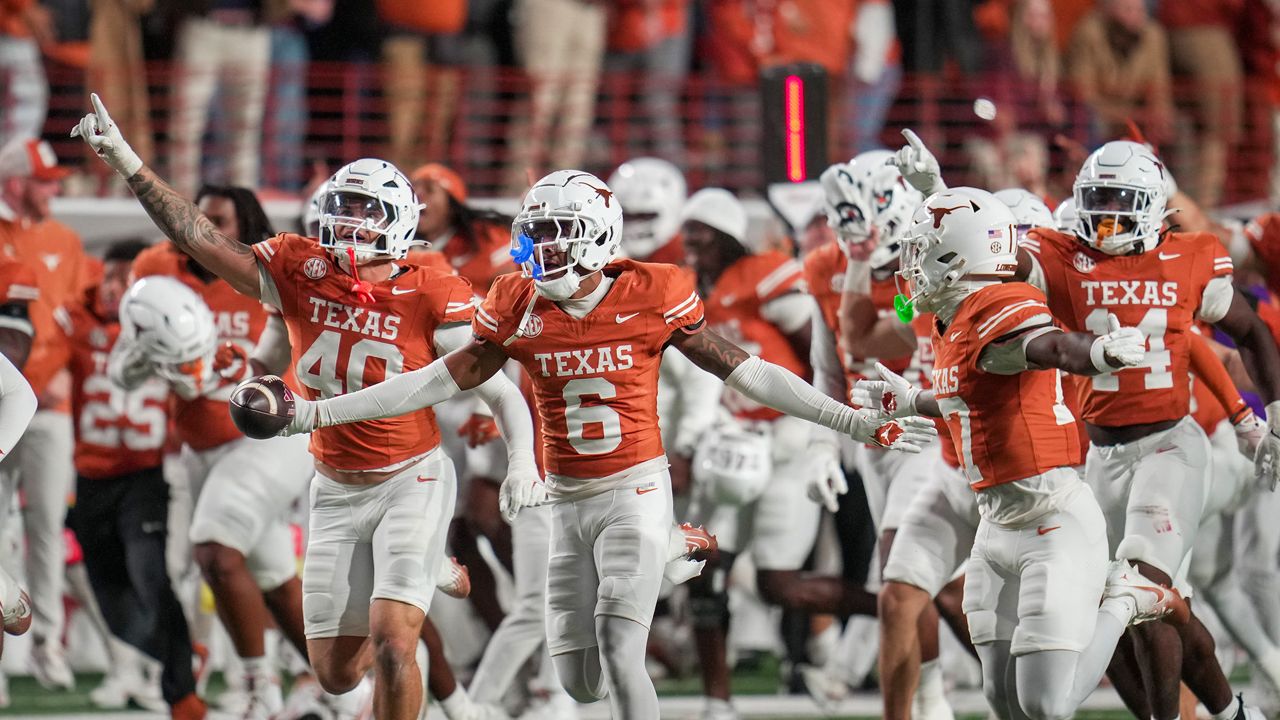 Texas Longhorns defensive back Kobe Black (6) celebrates an interception late in the 4th quarter against Texas A&M Aggies offense in an NCAA college football game in the Lone Star Showdown in Austin, Texas, Friday, Nov. 28, 2025.