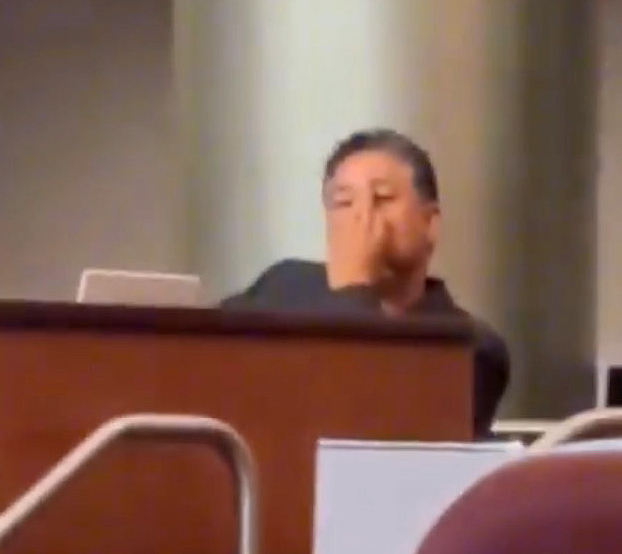 Oakland City Councilman Ken Houston making an obscene gesture.
