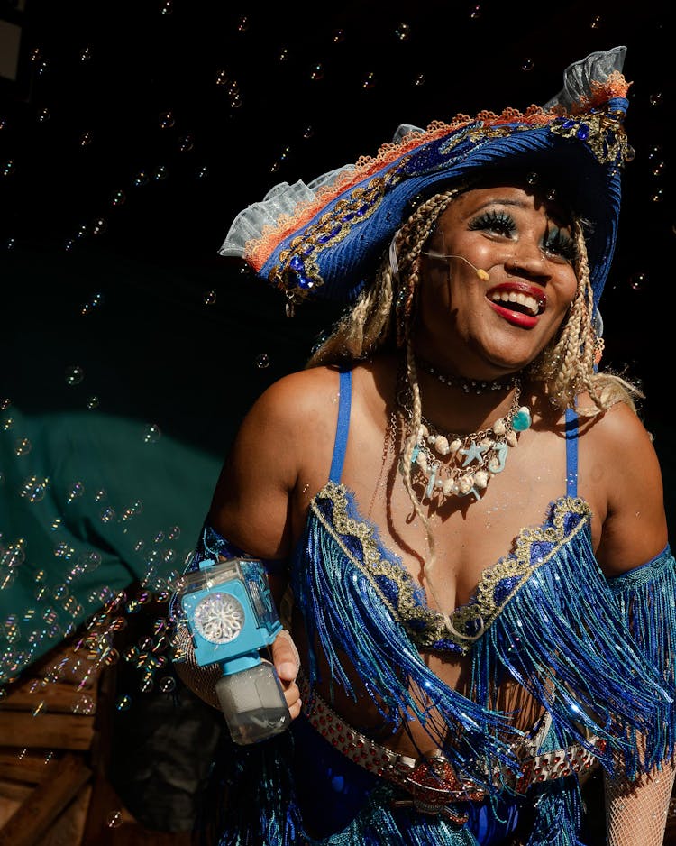 Tease of the Seas performers dance onstage with bubble machines at the fifty-first annual Texas Renaissance Festival.