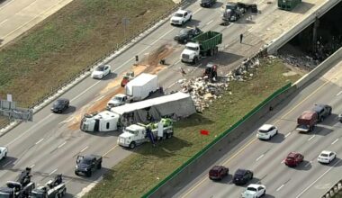 Semi hauling trash overturns on I-20 in Dallas, leading to miles of traffic backup