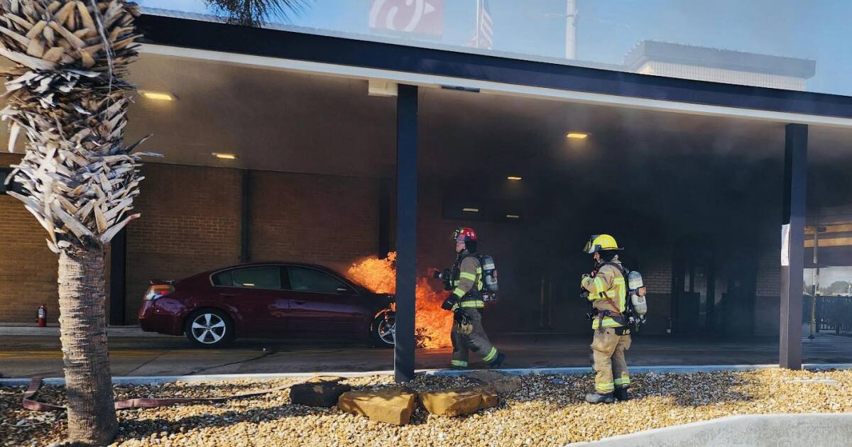 Vehicle fire at Chick-fil-A contained by firefighters